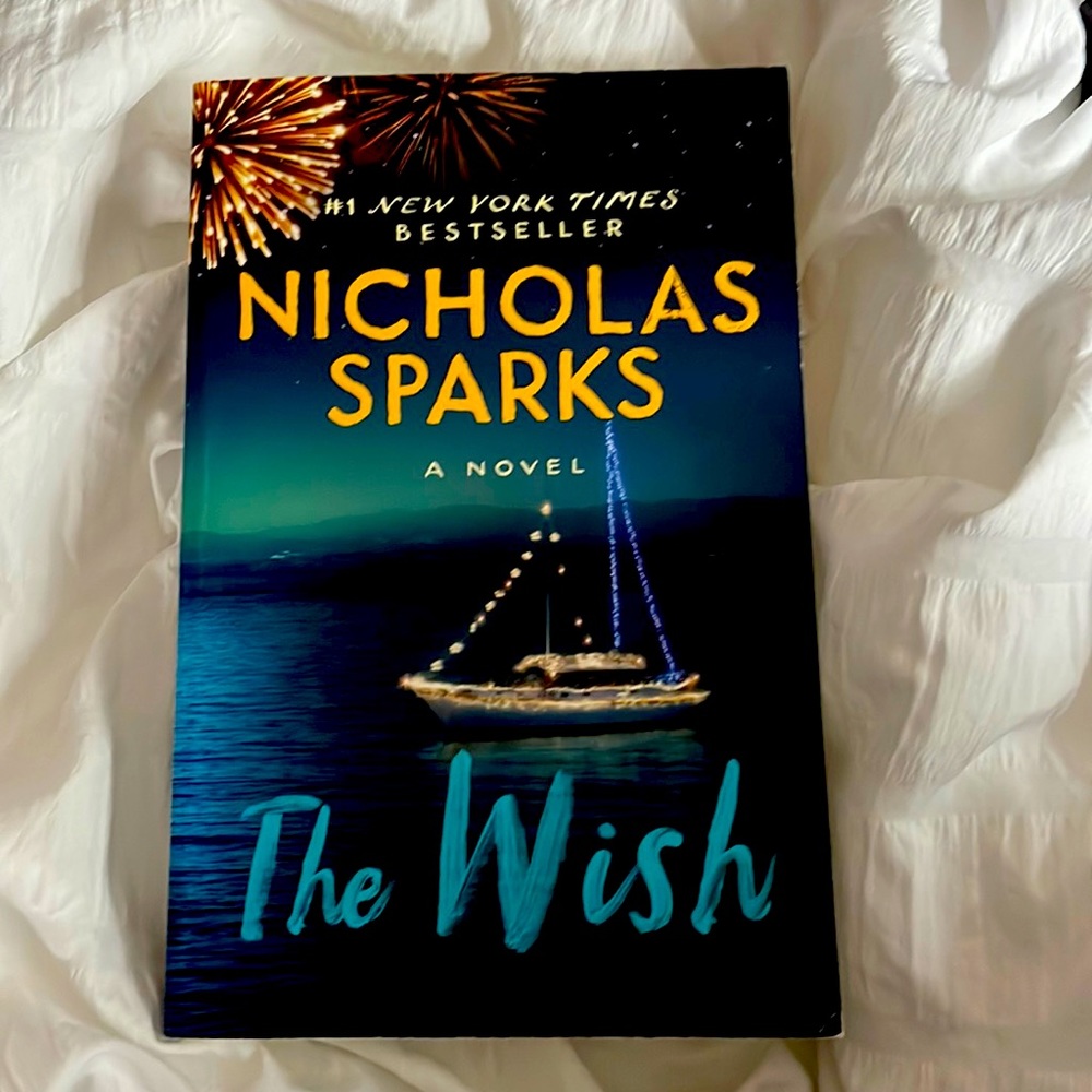Two books The House by Christina Lauren and The Wish by Nicholas Sparks
